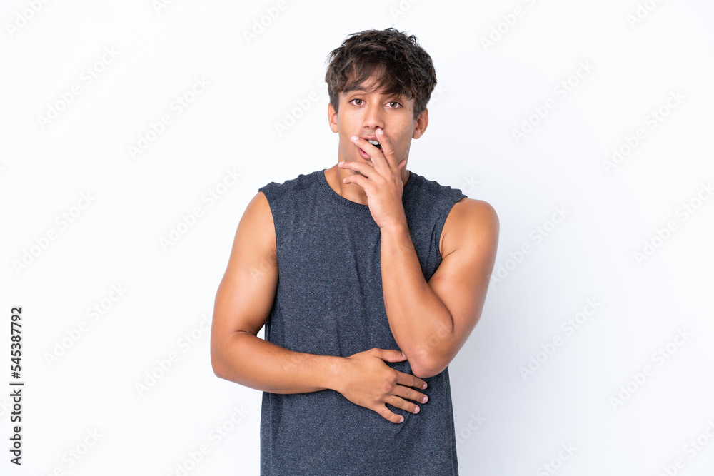 Young sport caucasian man isolated on white background surprised and shocked while looking right Young sport caucasian man isolated on white background surprised and shocked while looking right