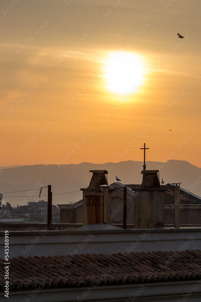 Obraz premium Sunrise over a church in Rome, Italy