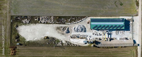 Aerial view of an open air white stone quarry in rural Castilla, Spain, surrounded by agriculture fields. photo