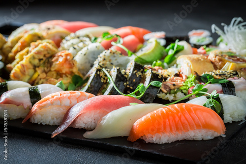 Fresh and colorful sushi set made of seafood and vegetables.