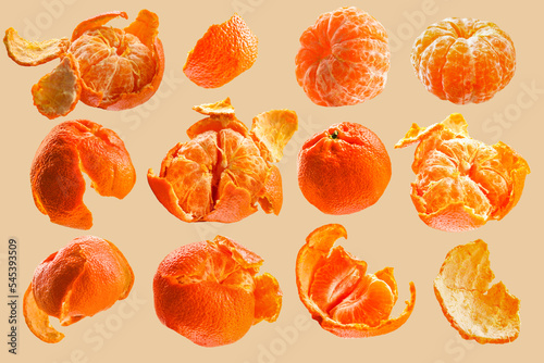Different types of tangerines on a pastel peach background. Peeled and whole tangerines.