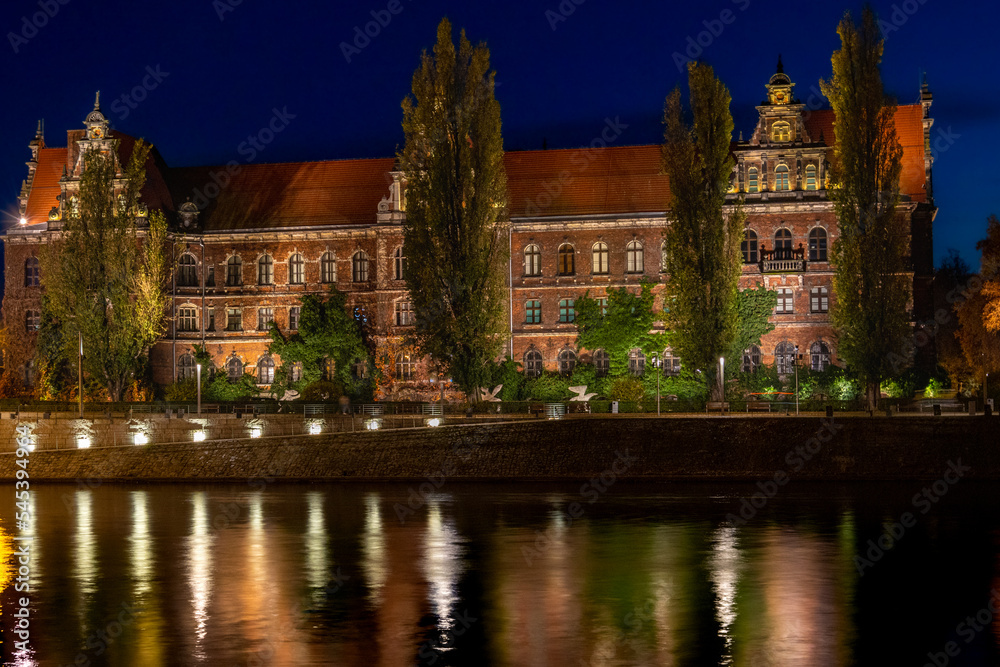 museum next to river at night