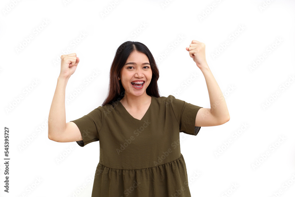Portrait of happy young asian woman standing while showing successful hand gesture. Isolated on white Portrait of happy young asian woman standing while showing successful hand gesture. Isolated on white