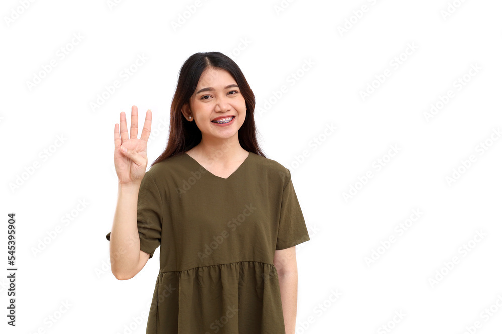 Happy young asian woman standing while showing four fingers hand gesture. Isolated on white background Happy young asian woman standing while showing four fingers hand gesture. Isolated on white background