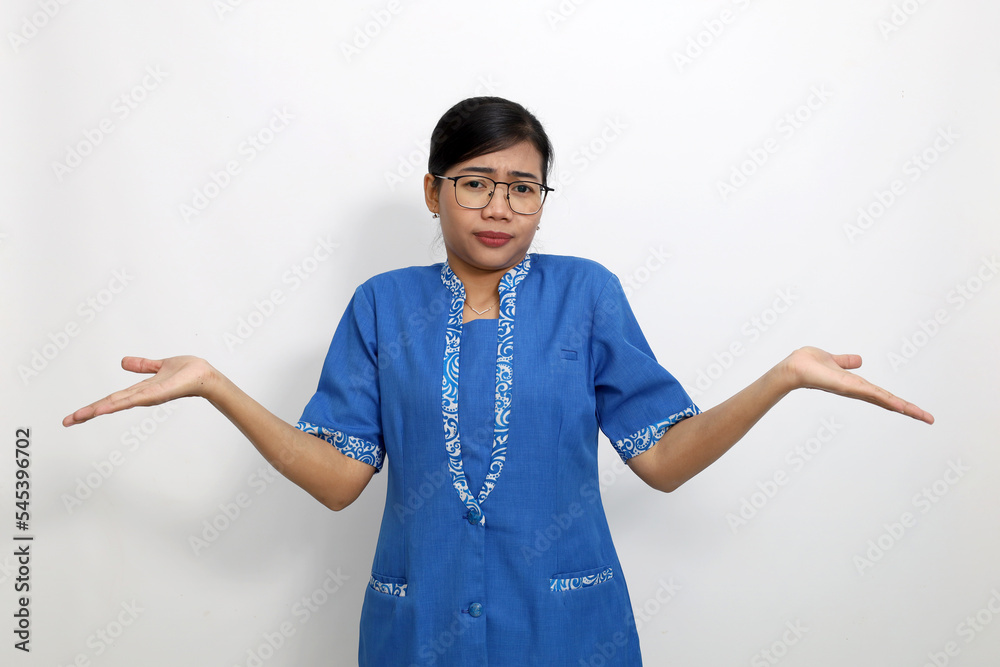 Young asian woman standing with confused gesture. Isolated on white background