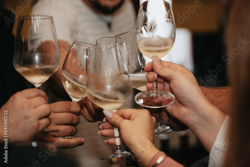 Cheers, we celebrate friendship with a glass of wine white, rose and champagne with friends and loved ones in a memorable evening.