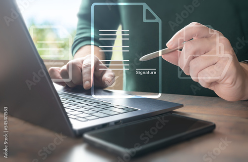 Business people sign electronic documents on digital documents, paperless office, business contract signing. Electronic signature concept. contract hologram image for signature