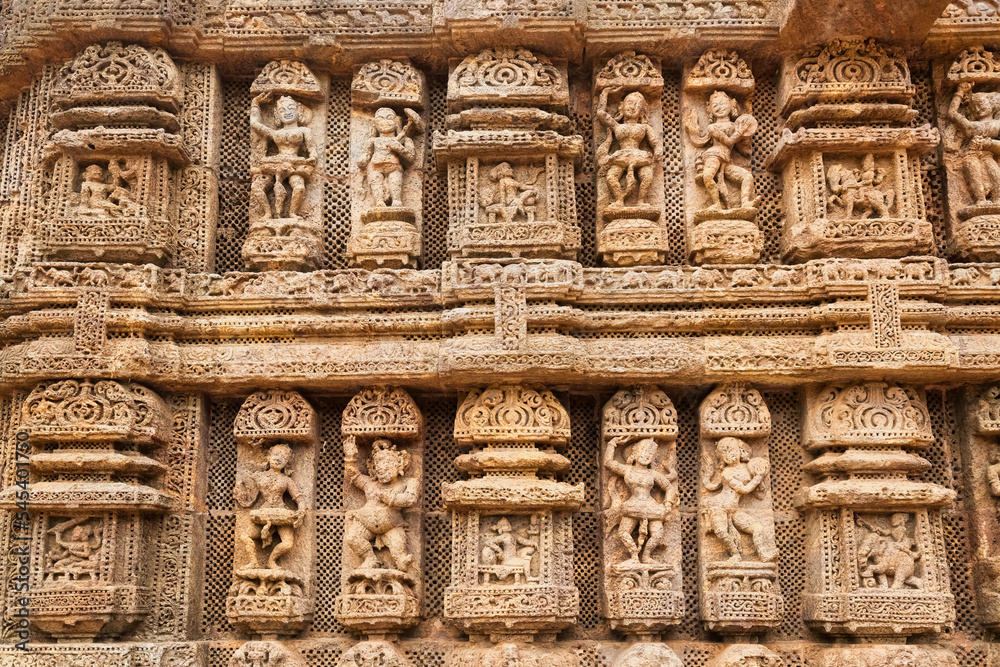 Konark sun temple wall with stone sculptures, carvings and artwork from the 13th century at Puri, Odisha, India