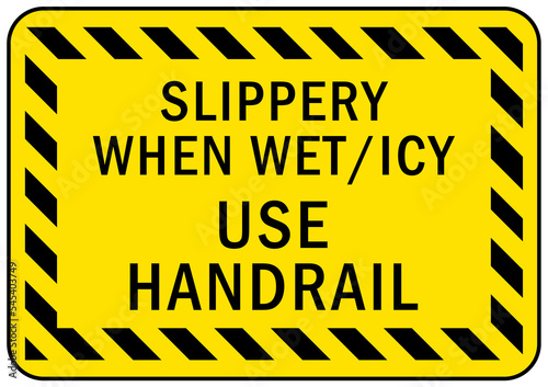 Icy warning sign slippery when wet, use handrail