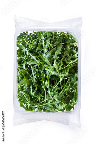 Aragula Lettuce - Isolated on White Background - plastic Package Wrapped in Clear Plastic - Top View, Macro Close Up - Isolated on White Background