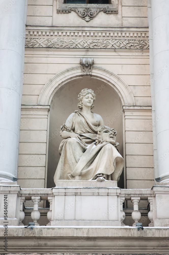 The big sculpture muse of tragedy or comedy on the facade of the Opera and Ballet Theater in Lviv. Neoclassicism in architecture.