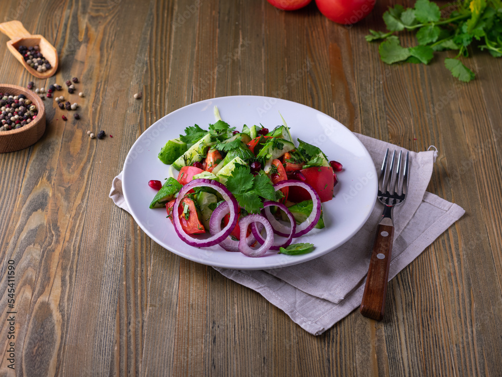 Fresh salad with olive oil, lettuce, cherry tomatoes, bell pepper, feta, olives. healthy food.