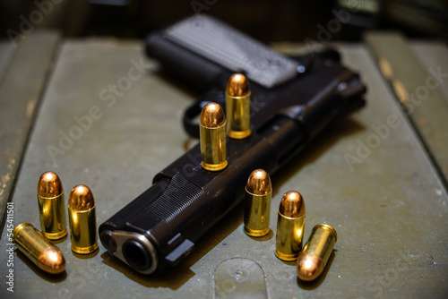 Pistol m1911 45acp and bullets. 
