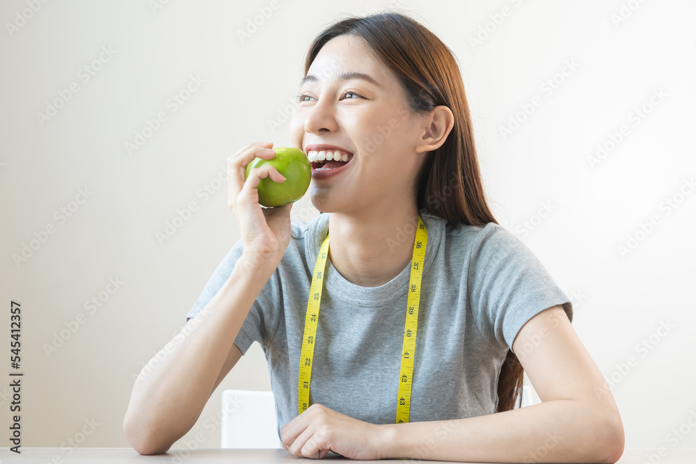Diet food concept, Close up portrait smile, cheerful asian young woman, girl with healthy teeth, hand holding or eating organic fresh green apple when hungry, isolated on white background healthcare. Diet food concept, Close up portrait smile, cheerful asian young woman, girl with healthy teeth, hand holding or eating organic fresh green apple when hungry, isolated on white background healthcare.
