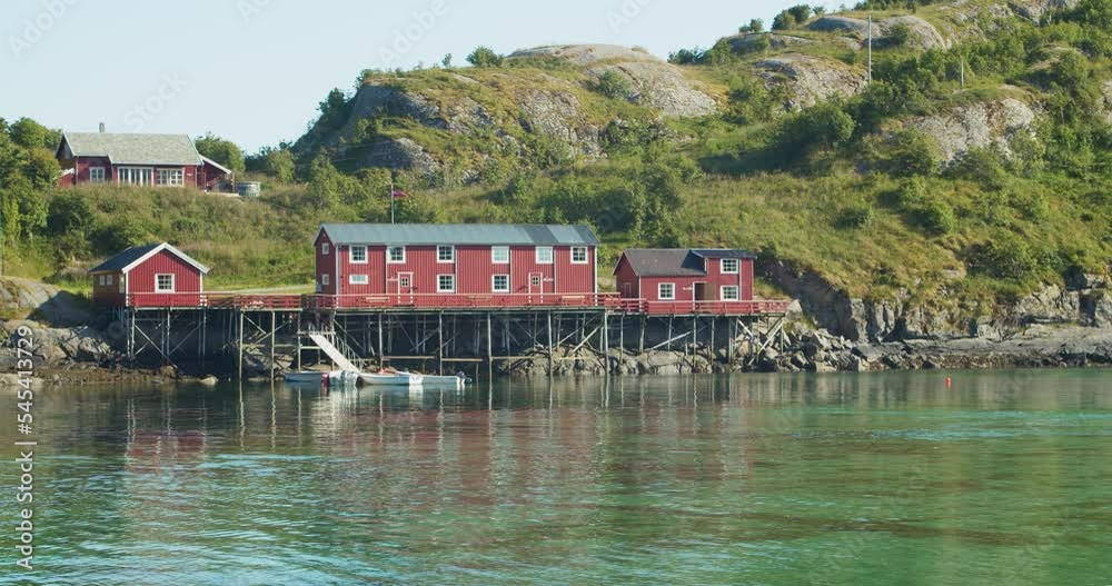 Traditional Norwegian red hut next to a lake in a mountain landscape. A small fishing harbor. Holidays and recreation concept.
Traditional Norwegian red hut next to a lake in a mountain landscape. A small fishing harbor. Holidays and recreation concept.