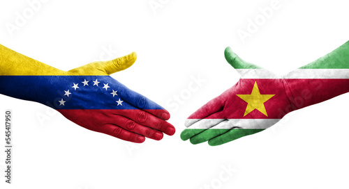 Handshake between Suriname and Venezuela flags painted on hands, isolated transparent image.