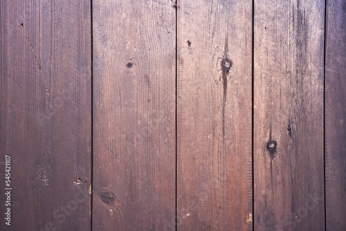 Natural wood background texture with wood grain pattern, knots and cracks in narrow boards. 