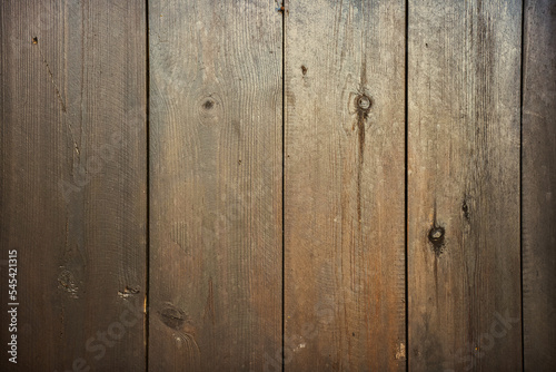 Natural wood background texture with wood grain pattern, knots and cracks in narrow boards. 
