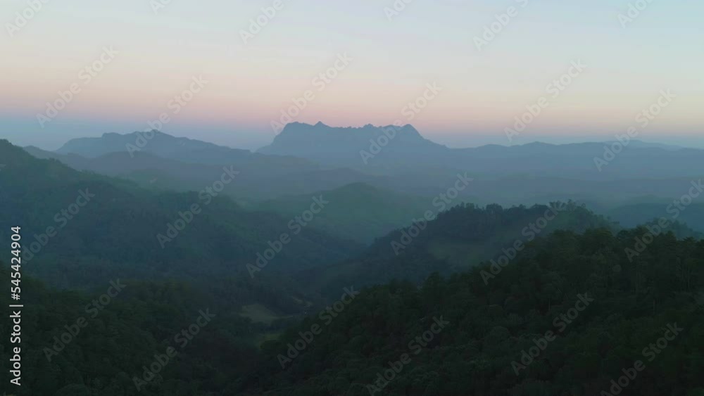 Aerial top view of forest trees and green mountain hills with sea fog, mist and clouds. Nature landscape background, Thailand. Aerial top view of forest trees and green mountain hills with sea fog, mist and clouds. Nature landscape background, Thailand.