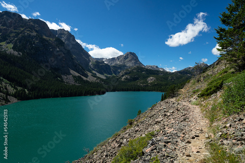 Alpine lake and trail in the Beartooth Mountains photo
