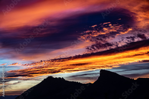 Spectacular cloudy sunset over the Sierra Elvira mountains (Granada, Spain) in autumn photo