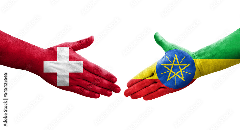 Handshake between Switzerland and Ethiopia flags painted on hands, isolated transparent image.