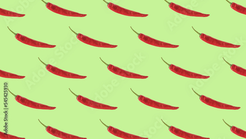 Seamless pattern of red pepper on a green background. The minimal concept of a popular seasoning.