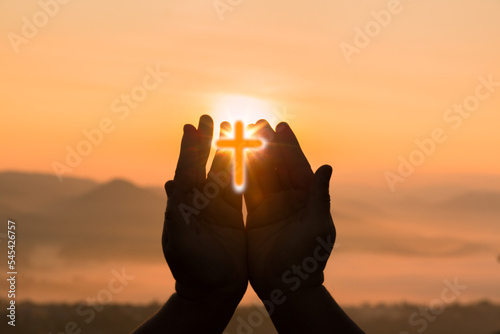 Cross is a symbol of Christianity. Human hands open palm up worship. Eucharist Therapy Bless God Helping Repent Catholic Easter Lent Mind Pray. Christian concept background.