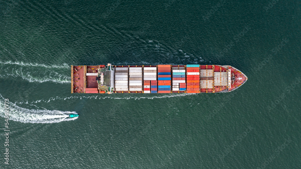 Fototapeta premium Aerial view container cargo ship global business logistic transportation import export container box, Container cargo ship boat freight shipping maritime commercial port, Cargo vessel industrial port.