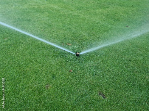 Garden irrigation system watering lawn and grass