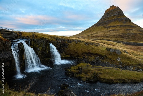 Low angle of the beautiful mountain and fountain peak Kirkjufell on Snaefellsnes peninsula, Iceland © Matthew Simpson/Wirestock Creators