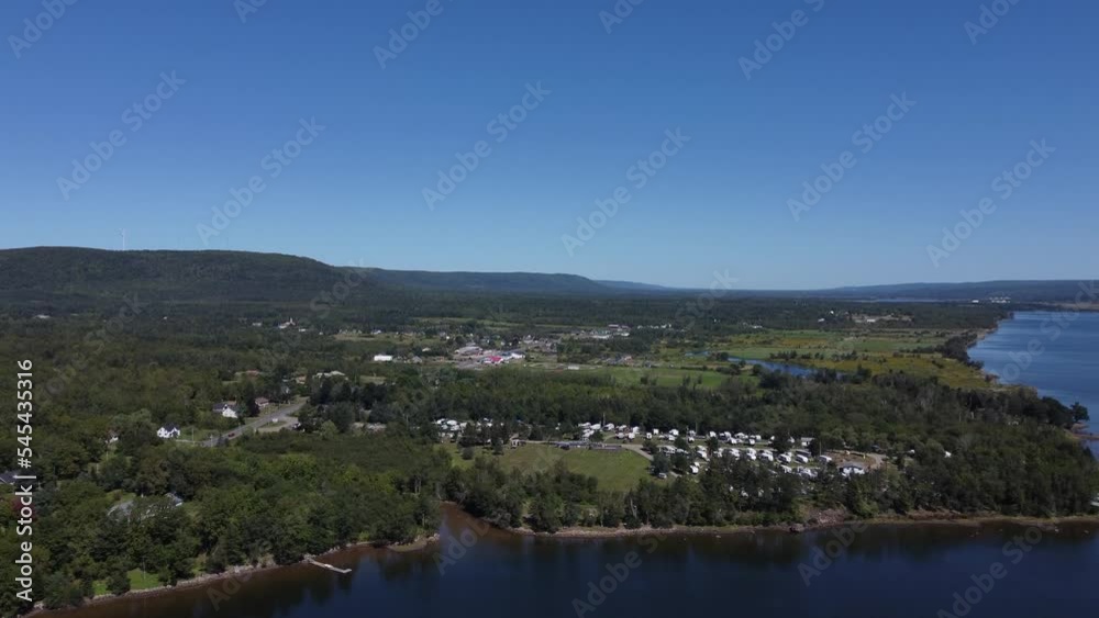 Aerial movement around Nova Scotia town surrounded by buildings and trees near Annapolis River Aerial movement around Nova Scotia town surrounded by buildings and trees near Annapolis River