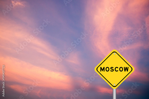 Photography Yellow transportation sign with word moscow on violet color sky background