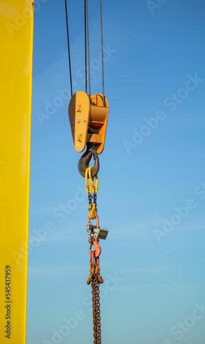gantry crane with hook against blue sky