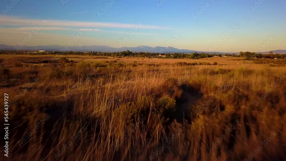 Drone shot of a trail and a landscape during the sunset in Costa Mesa, California, USA Drone shot of a trail and a landscape during the sunset in Costa Mesa, California, USA