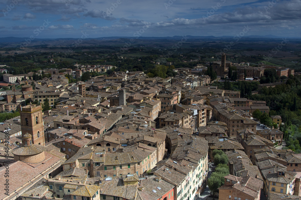 Scenery of Siena, a beautiful medieval town in Tuscany, landmark Mangia Tower and Basilica of San Domenico, Italy