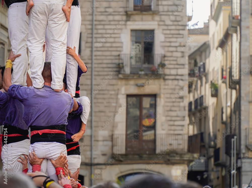 Tower of group of people in Catalonia. Spanish traditional and culture show Tower of group of people in Catalonia. Spanish traditional and culture show