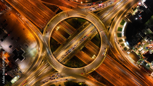 Aerial drone night photo of illuminated urban elevated toll ring road junction and interchange overpass passing through Kifisias Avenue, Attica, Greece © aerial-drone