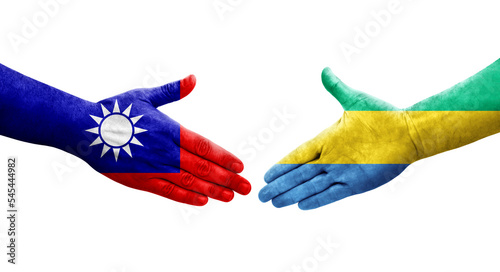 Handshake between Taiwan and Gabon flags painted on hands, isolated transparent image.