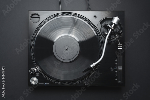Dj turntable in flay lay. Turn table playing vinyl record with music.