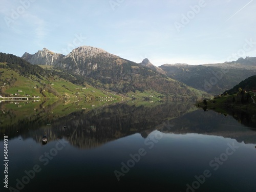 Beautiful shot of a lake reflecting the surrounded landscape