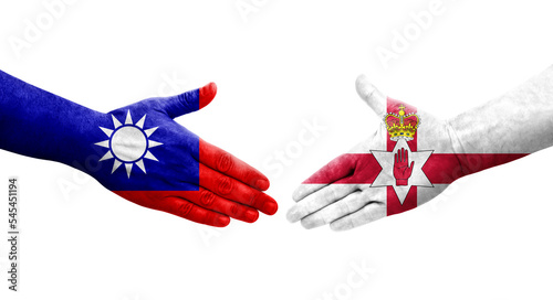 Handshake between Taiwan and Northern Ireland flags painted on hands, isolated transparent image.