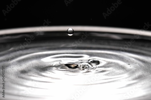 Macro shot of splashing water drop, grayscale shot