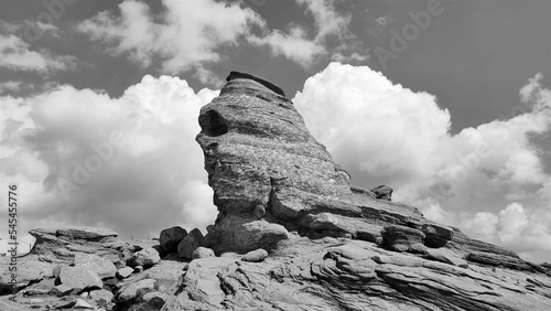 Grayscale of Sphinx rock formation in Bucegi Mountains, Romania photo