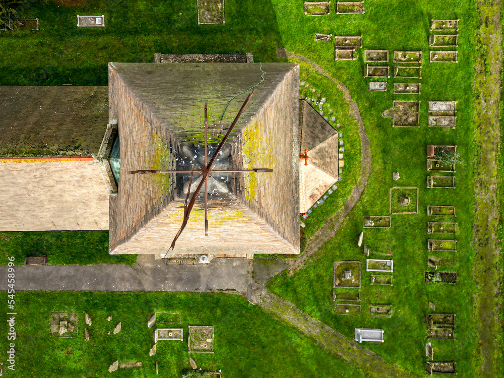 Φωτογραφία Top down drone view of a tall church spire showing the ornate weather vane and lead
