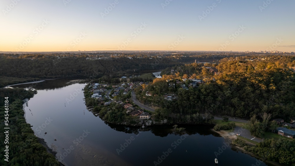 View of Woronora River surrounded by lush greenery at sunset in Sydney, New South Wales, Australia View of Woronora River surrounded by lush greenery at sunset in Sydney, New South Wales, Australia