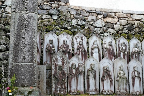 Buddhist religious statues in Akechi Mitsuhide family cemetery in Saikyoji temple in Hieizan, Japan photo