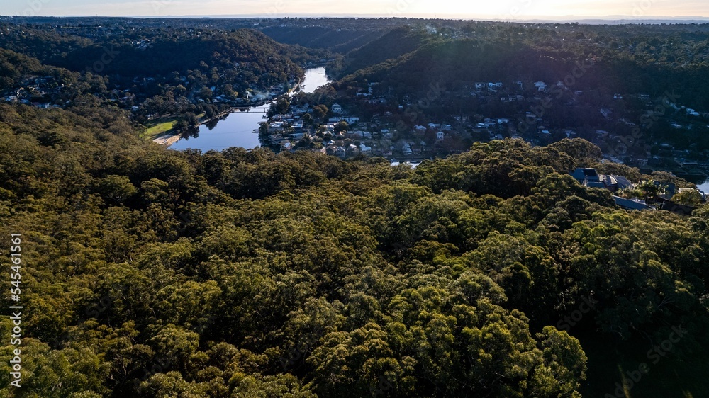 Woronora River surrounded by lush greenery and Woronora Bridge in Sutherland suburb South Sydney