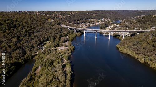 Woronora River surrounded by lush greenery and Woronora Bridge in Sutherland suburb South Sydney