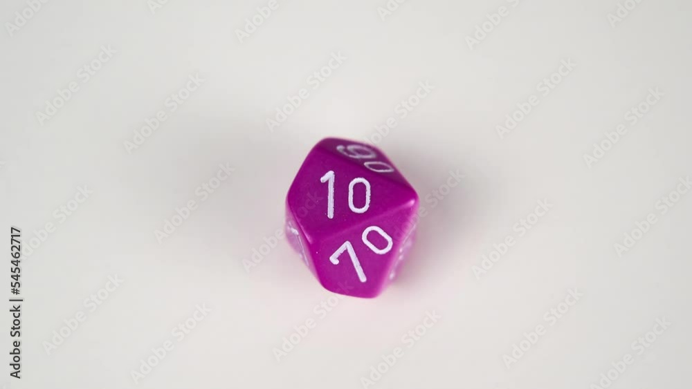 Stop frame animation of a purple D10 Percentile gaming die used for table top role playing games Stop frame animation of a purple D10 Percentile gaming die used for table top role playing games